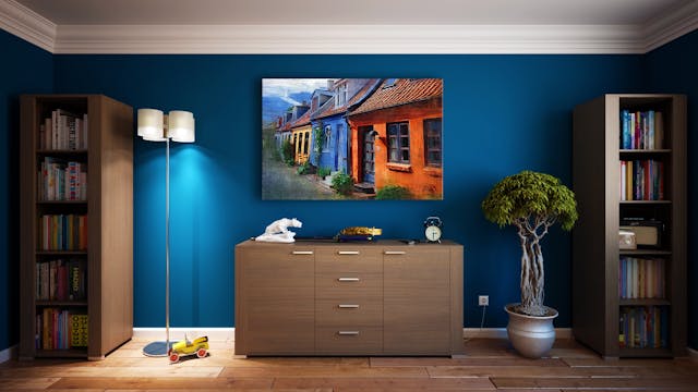 a%20dresser%20and%20two%20bookcases%20again%20a%20dark%20blue%20wall